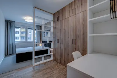 The floor decor is also used on the wall behind the bed.